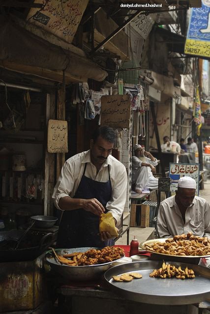 Glasses of masala chai poured at the counter